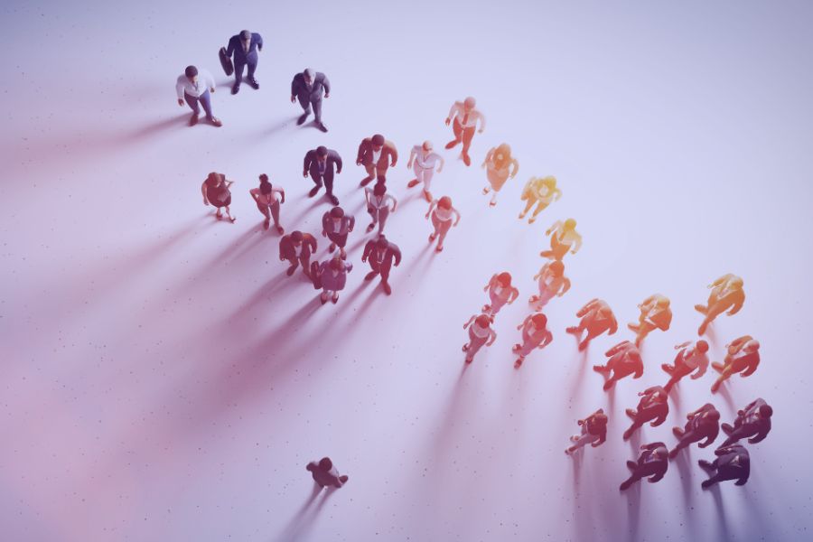 People forming directional arrow